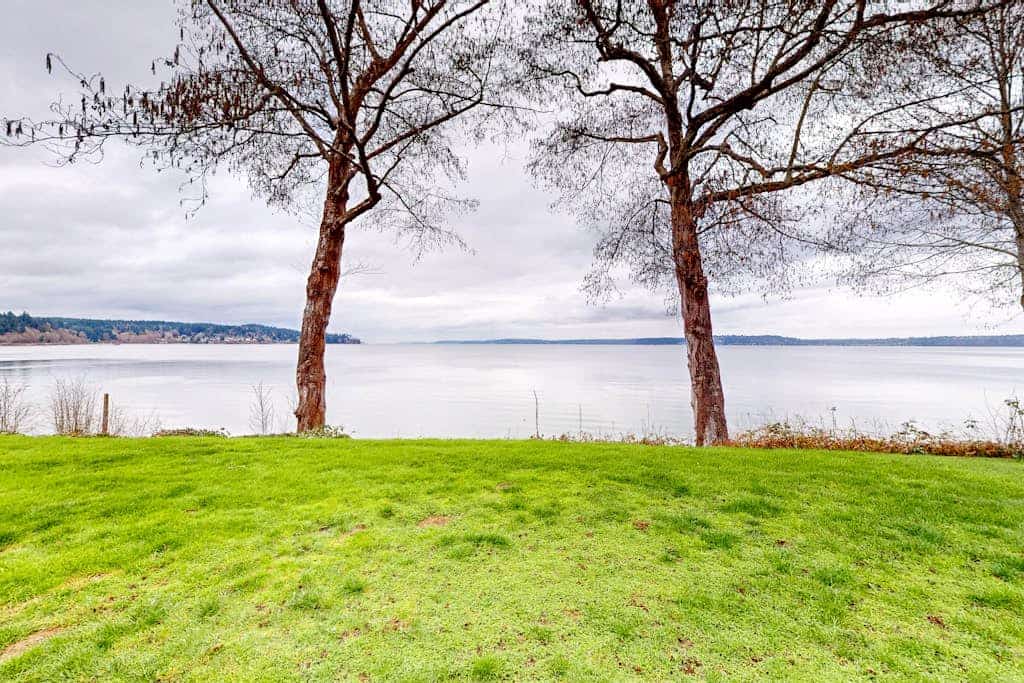Stunning waterfront escape with patio, beach access, & gorgeous bay views