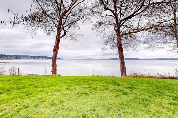 Stunning waterfront escape with patio, beach access, & gorgeous bay views
