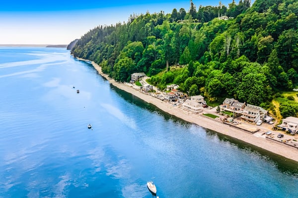 Dog-friendly home with a great deck, ocean view & firepit on beachfront lawn