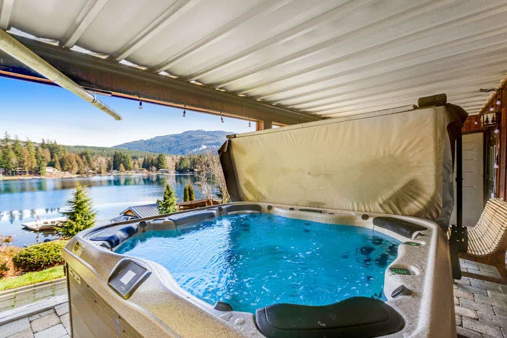 Custom lakefront gem with private dock, hot tub, firepit, & chef's kitchen