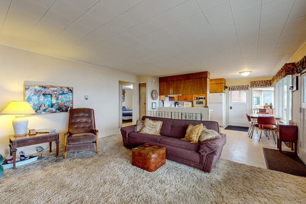 Charming waterfront home with expansive deck & gorgeous sunset views