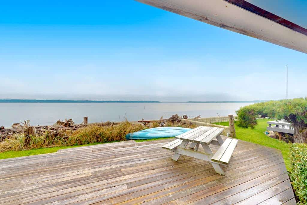Charming waterfront home with expansive deck & gorgeous sunset views