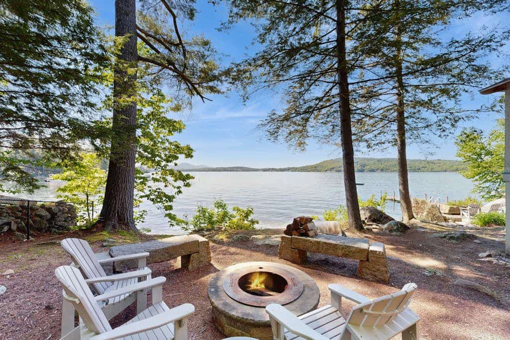 Captivating lakefront home with private dock, row boat, firepit, and lake views