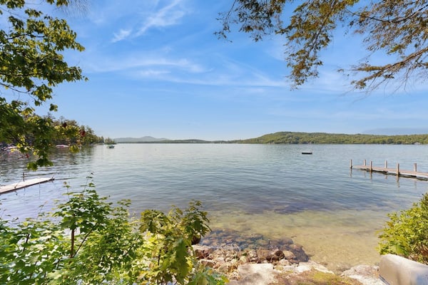 Captivating lakefront home with private dock, row boat, firepit, and lake views