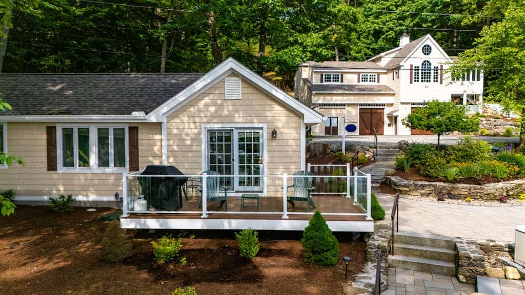 Stunning lakefront property with beach access, a dock, spacious yard, & W/D