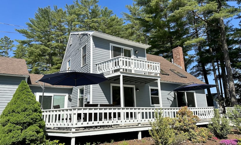 Lakefront home with deck, game room, washer/dryer, grill, dock, & views