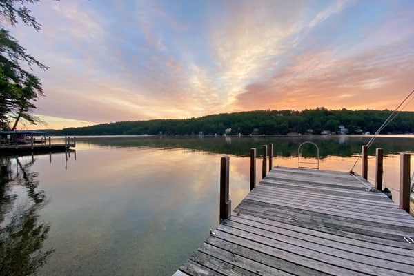 Lakefront home with deck, game room, washer/dryer, grill, dock, & views