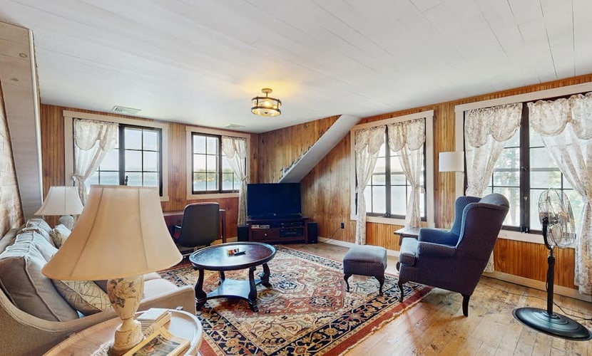 Quintessential lakefront home with woodstove, beach access, dock & washer/dryer