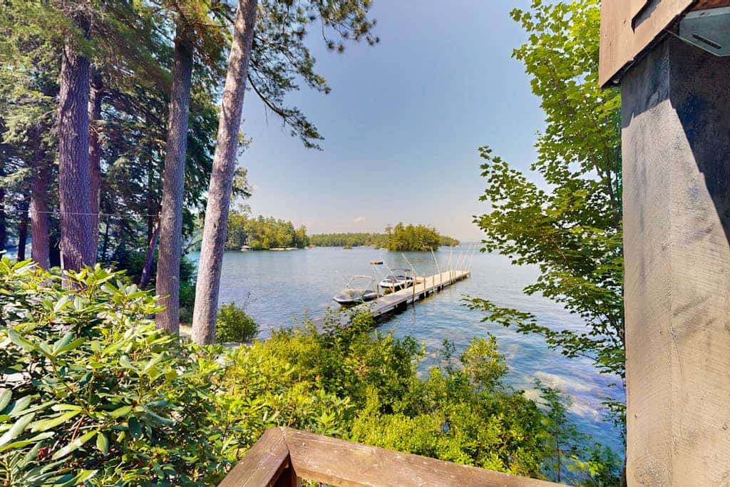Quintessential lakefront home with woodstove, beach access, dock & washer/dryer