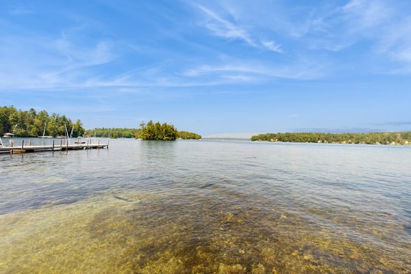 Quintessential lakefront home with woodstove, beach access, dock & washer/dryer