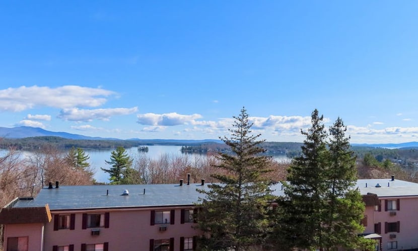 Water view condo with a pool, tennis court, fireplace, balcony & golf nearby