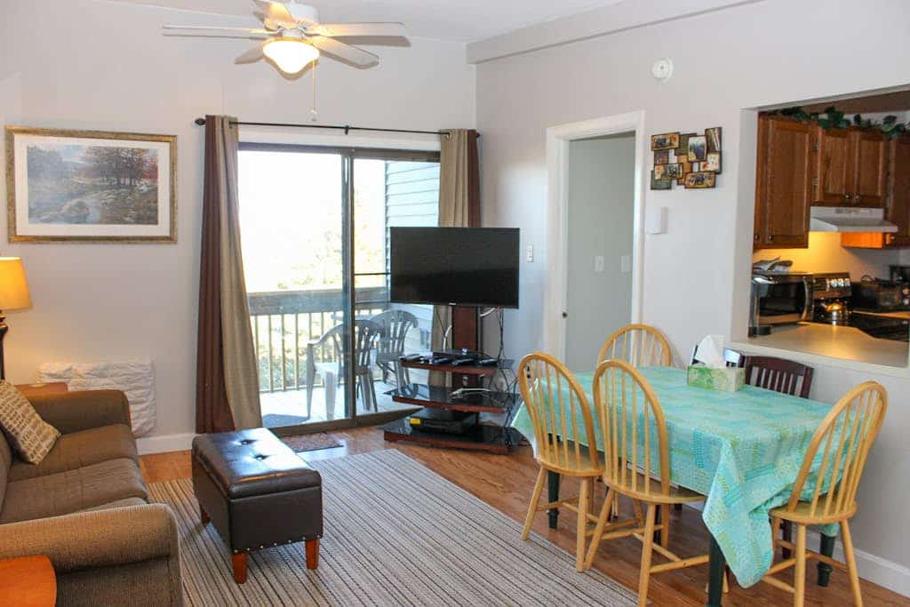 Water view condo with a pool, tennis court, fireplace, balcony & golf nearby