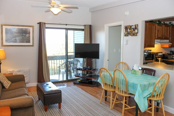 Water view condo with a pool, tennis court, fireplace, balcony & golf nearby