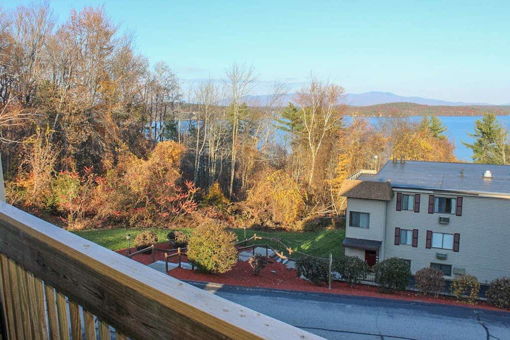 Water view condo with a pool, tennis court, fireplace, balcony & golf nearby