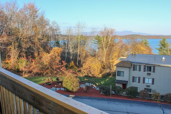 Water view condo with a pool, tennis court, fireplace, balcony & golf nearby