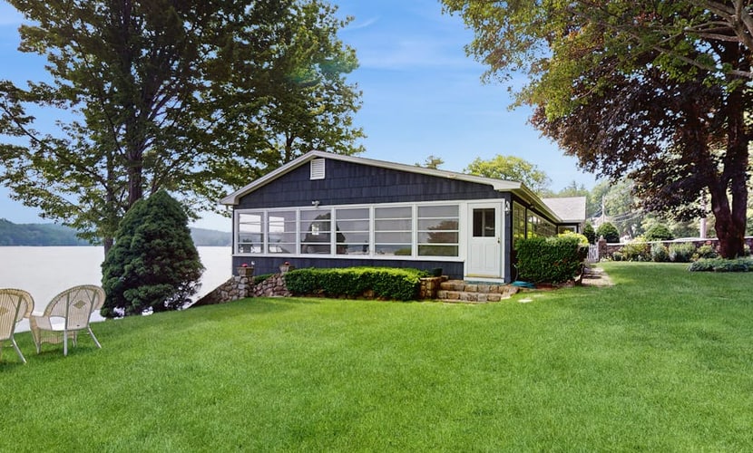 Lakeside paradise w/ lakefront deck, enclosed porch, 2 docks & large lawn