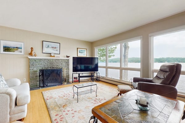 Lakeside paradise w/ lakefront deck, enclosed porch, 2 docks & large lawn