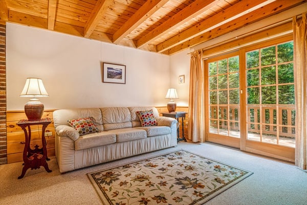 Charming lakefront cabin with private dock, deck & screened porch