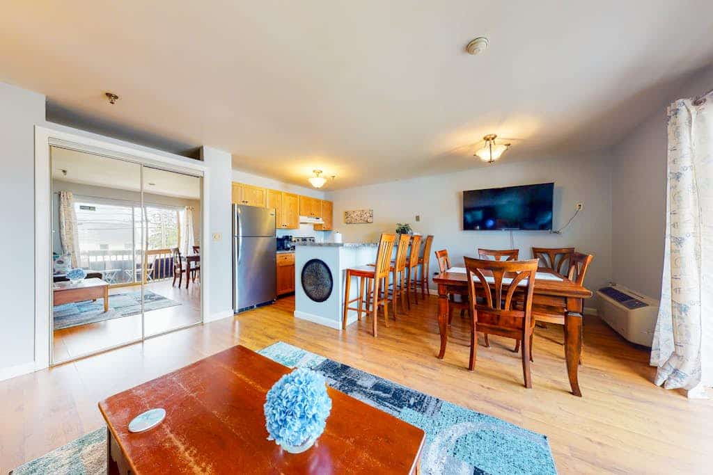 Inviting condo in quiet locale with partial lake views, balcony & grilling area