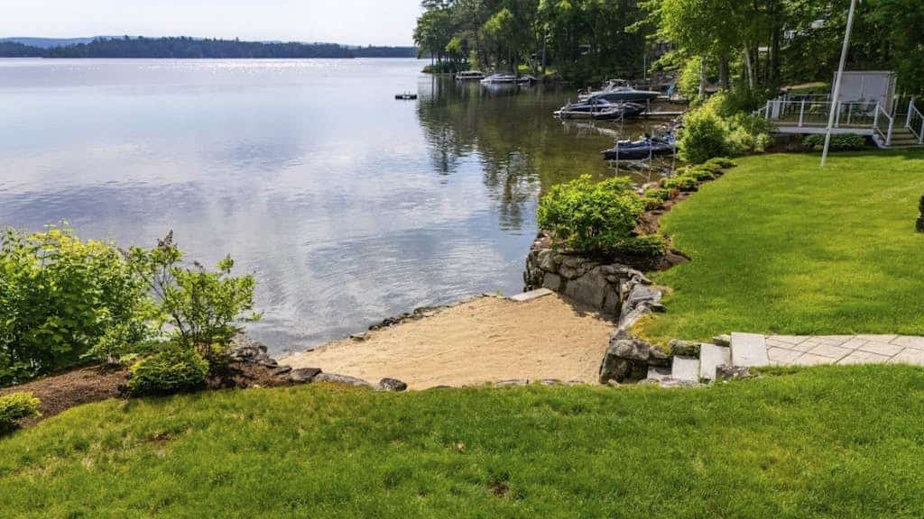 Stunning lakefront gem with full water view, beach access & dock