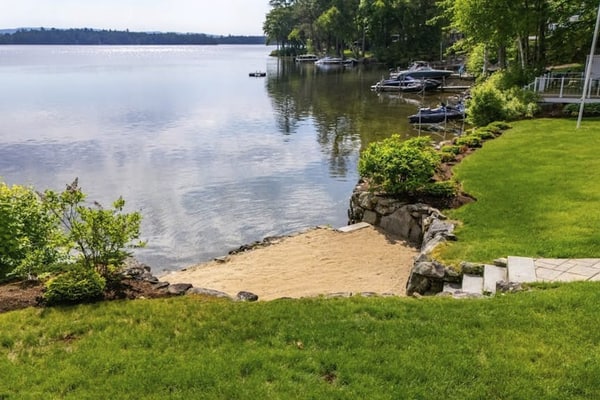 Stunning lakefront gem with full water view, beach access & dock