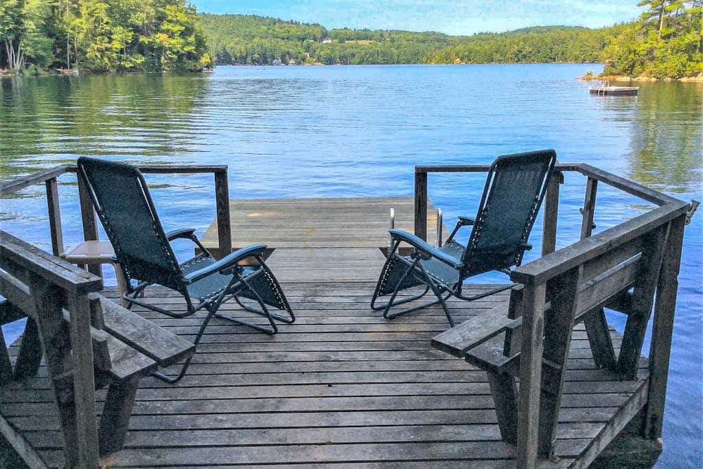 Chalet-style lakefront home with private dock, beach, kayak, canoe & epic view