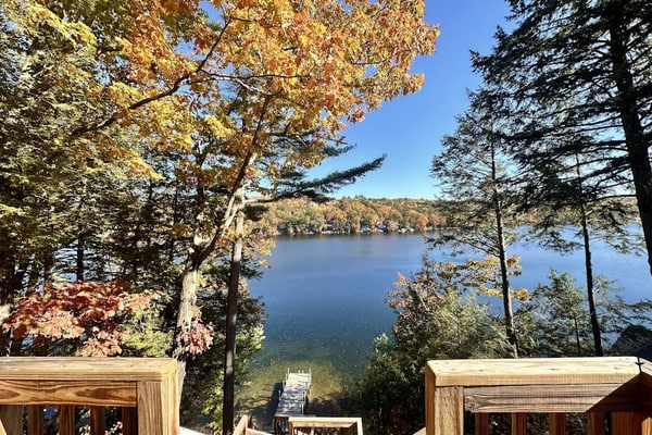 Two updated lakefront homes - dock with boat slip, game room, & screened porch