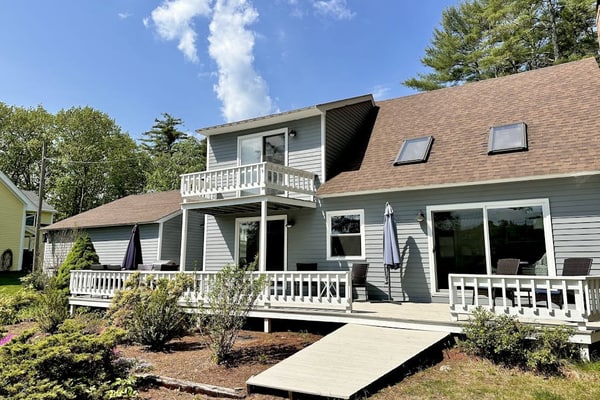 Two updated lakefront homes - dock with boat slip, game room, & screened porch