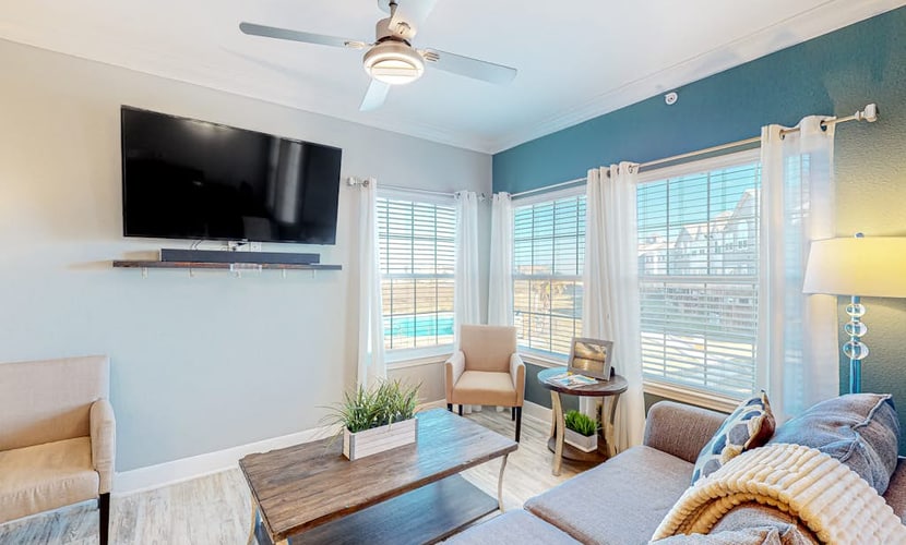 Modern, second-floor condo steps to beach with balcony, W/D, & pool access