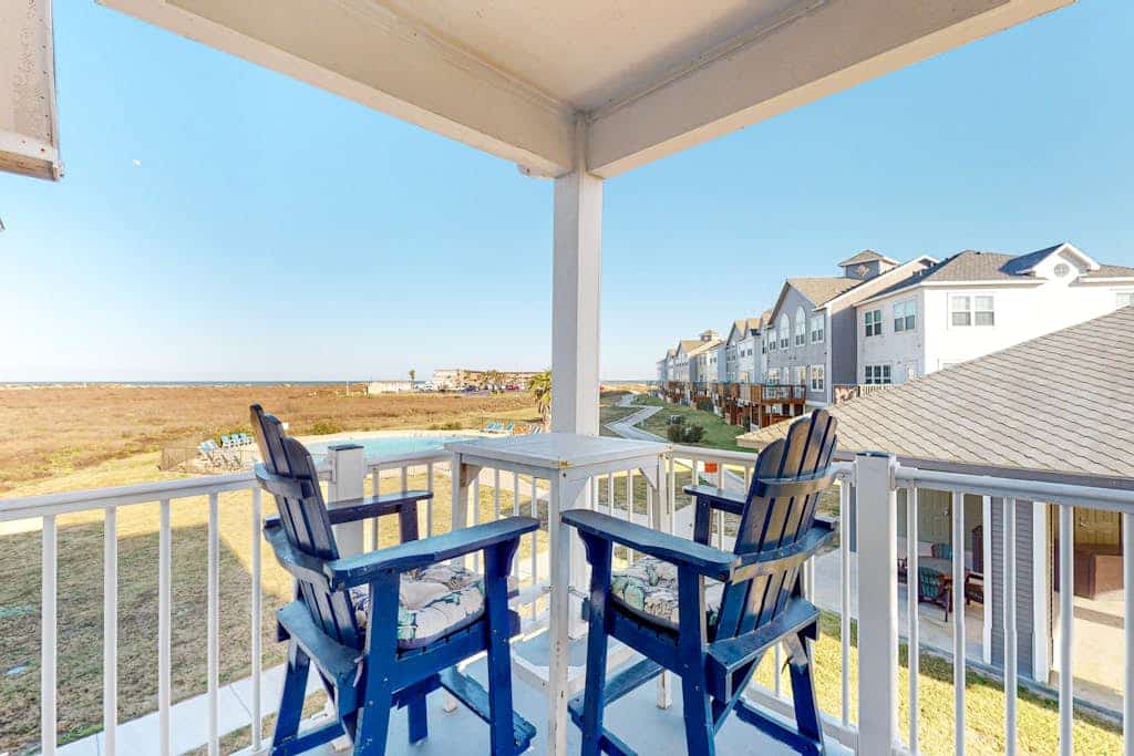 Modern, second-floor condo steps to beach with balcony, W/D, & pool access