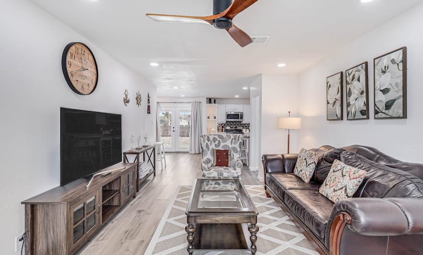Inviting house with large enclosed yard, central AC, washer/dryer, & golf nearby
