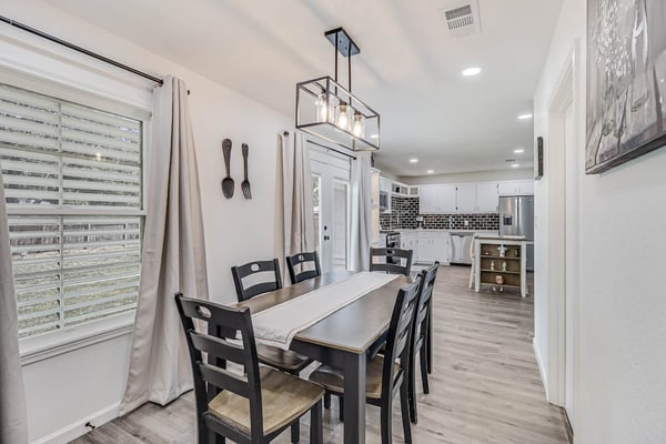 Inviting house with large enclosed yard, central AC, washer/dryer, & golf nearby