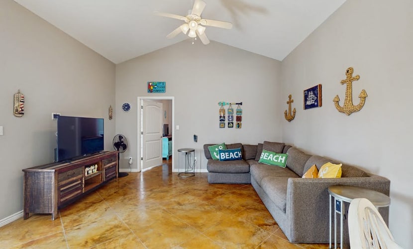 Coastal, dog-friendly townhouse with shared pool & large yard - steps to sand