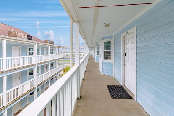 Gulf-view condo in beachfront complex with balcony, pool, hot tub, & central AC