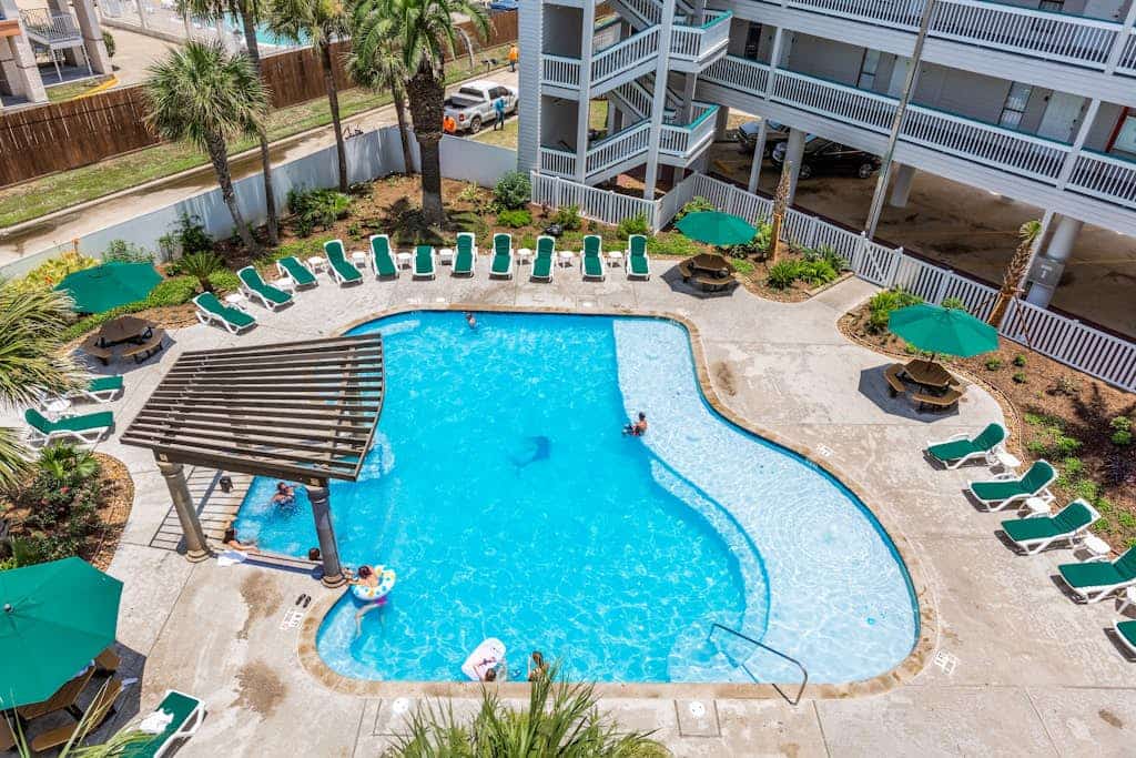Cute condo with shared pool, private balcony & great location