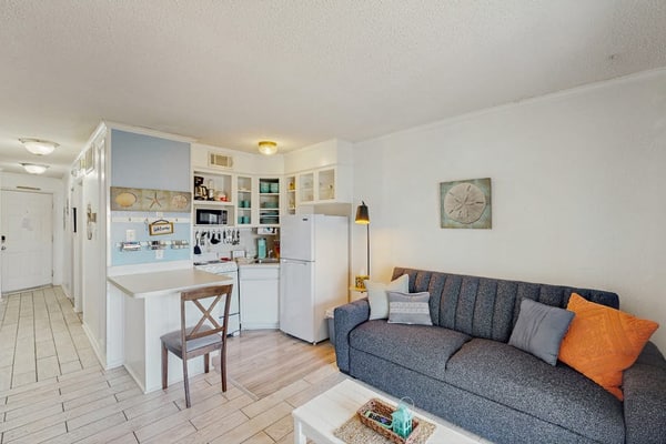Cute condo with shared pool, private balcony & great location