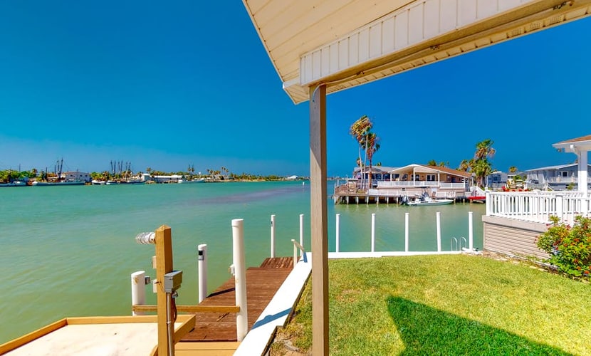 Gorgeous Intercoastal waterfront home on channel w/shared pool, hot tub, & dock