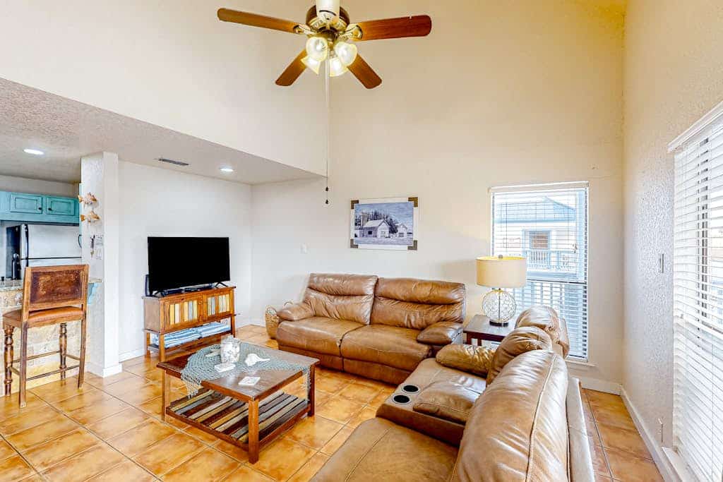 Canal-front condo with dock, hot tub, pool, BBQ area, cabana, water views, W/D