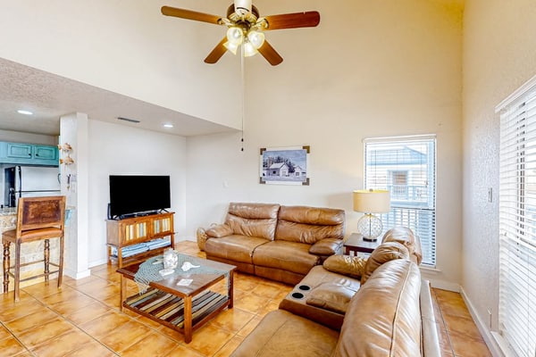 Canal-front condo with dock, hot tub, pool, BBQ area, cabana, water views, W/D