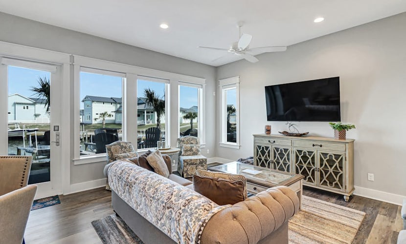 Sophisticated canal-view villa with pool, vast fishing pier, deck & washer/dryer