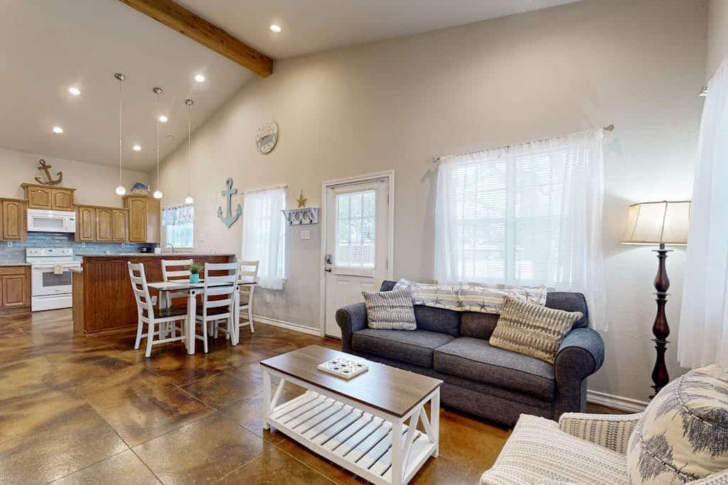 Coastal hideaway with fenced yard, firepit, central AC, & W/D - dog-friendly