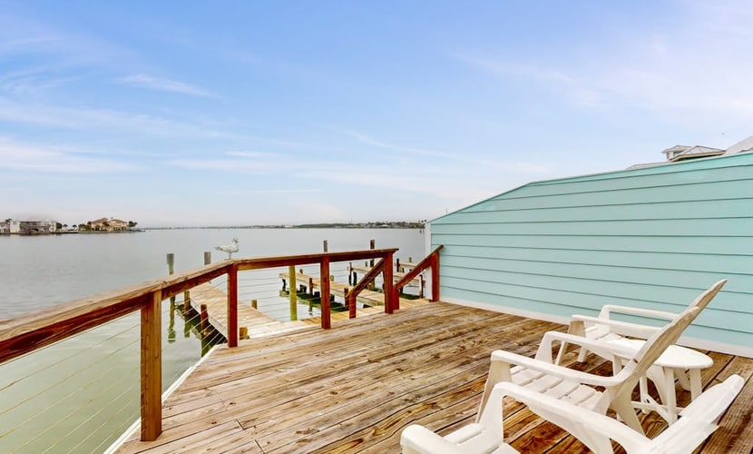Designer waterfront townhome with pool & dock access, amazing views