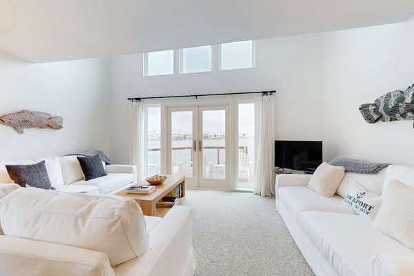 Designer waterfront townhome with pool & dock access, amazing views