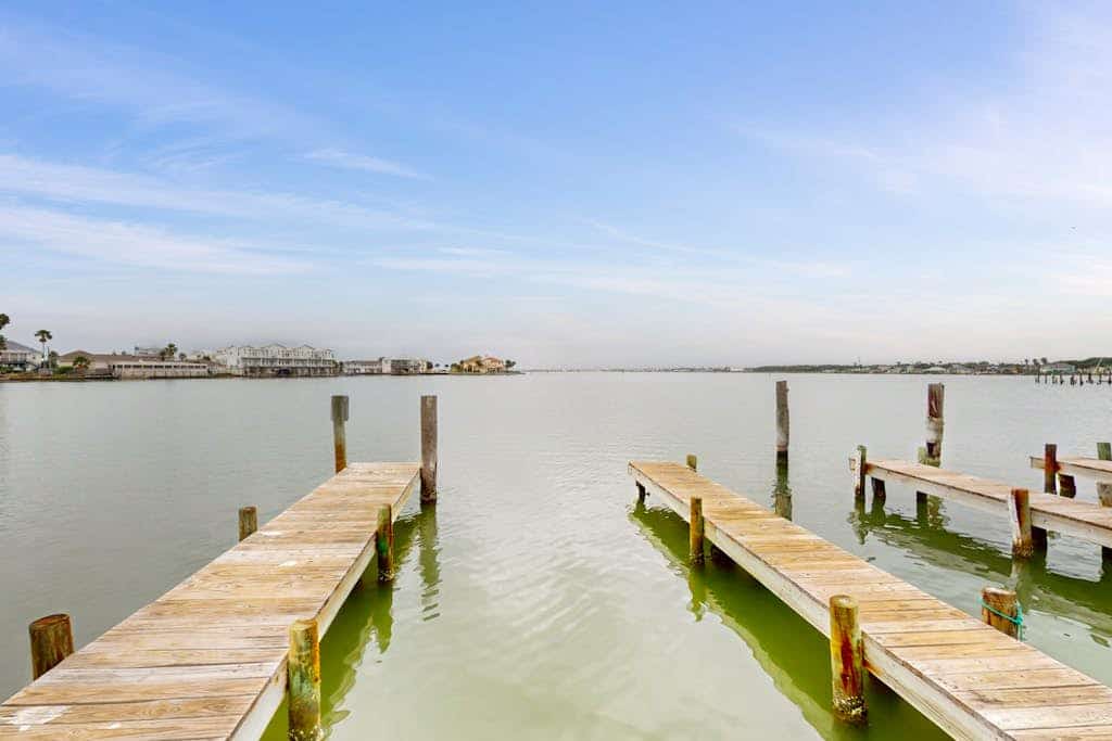 Designer waterfront townhome with pool & dock access, amazing views