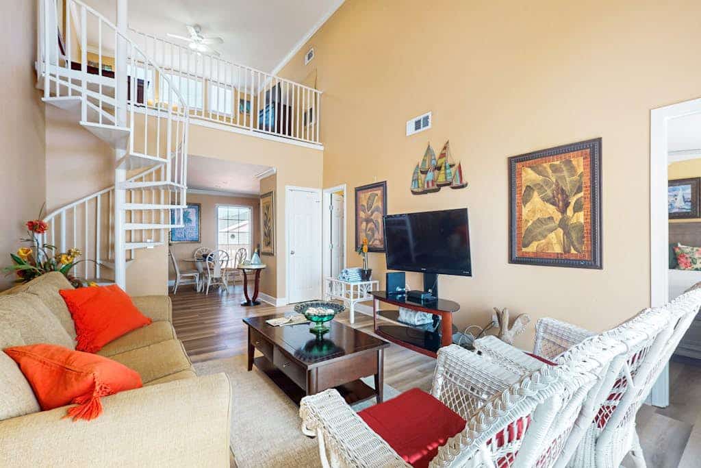 Charming condo with incredible views, pools & hot tub - steps from beach
