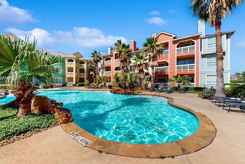 Charming condo with incredible views, pools & hot tub - steps from beach