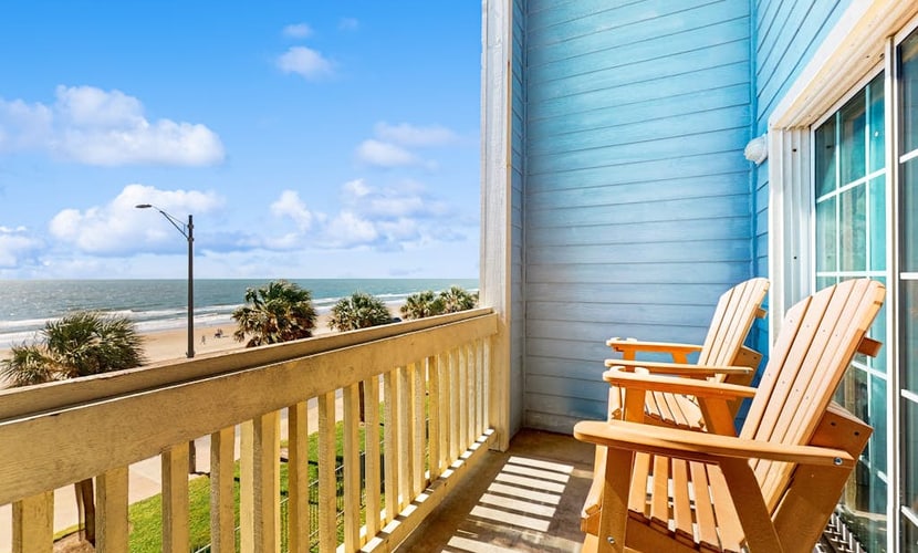 Charming condo with incredible views, pools & hot tub - steps from beach