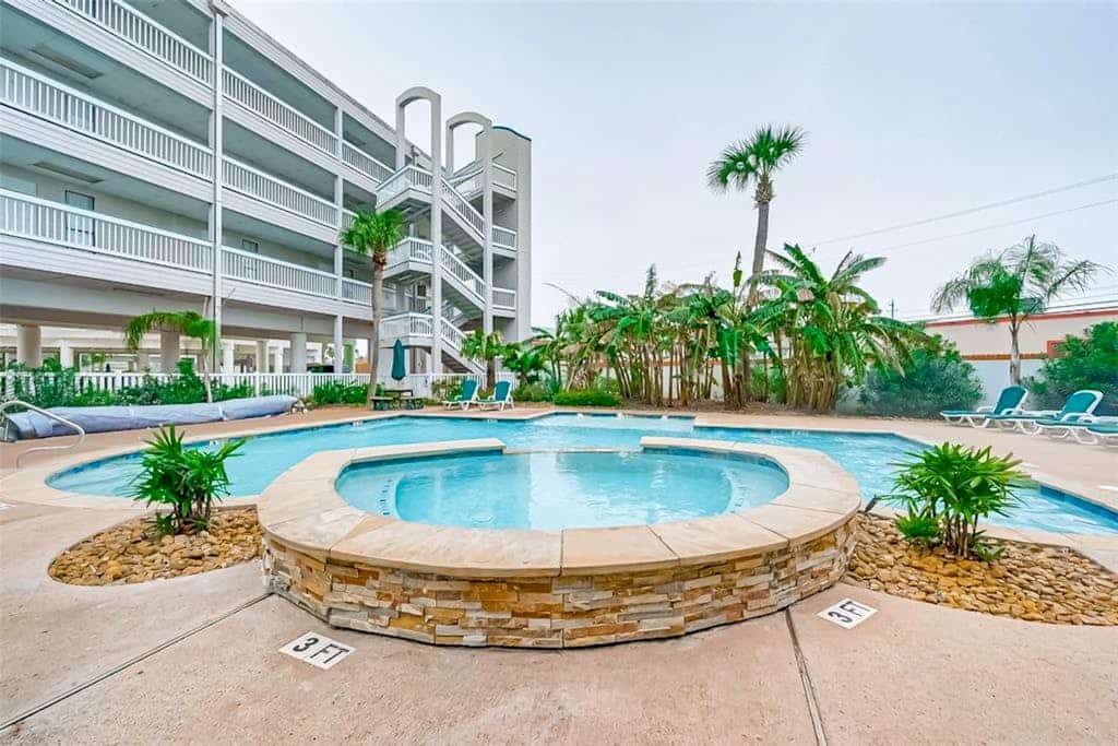 Beach-view condo steps from Babe’s Beach with pool, hot tub, balcony, & W/D