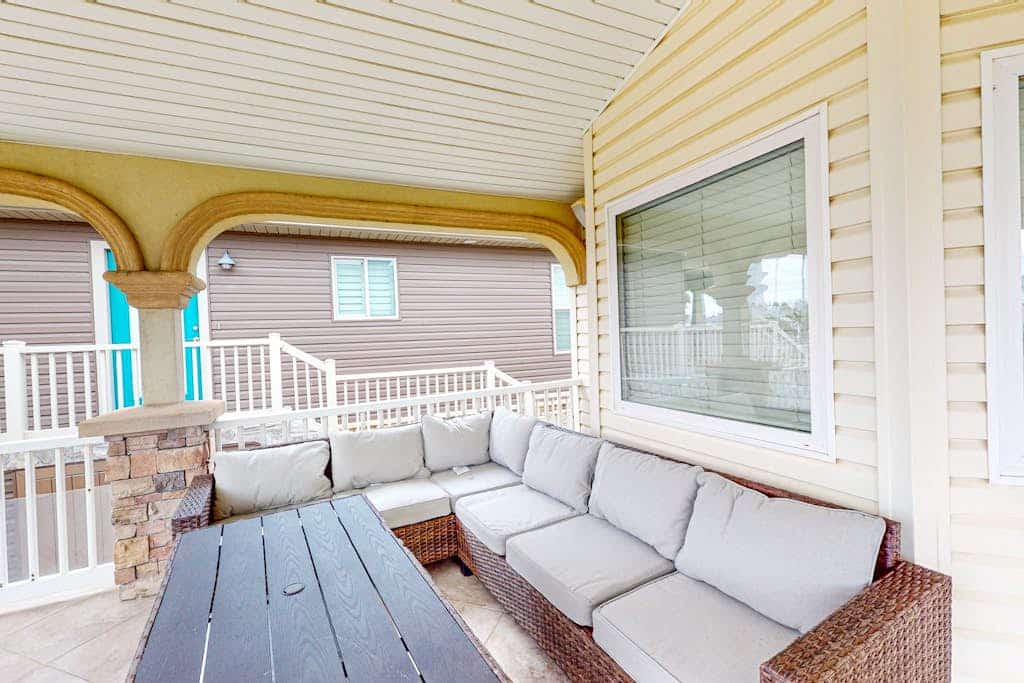 Single-level waterfront retreat with a furnished patio, AC, & washer/dryer