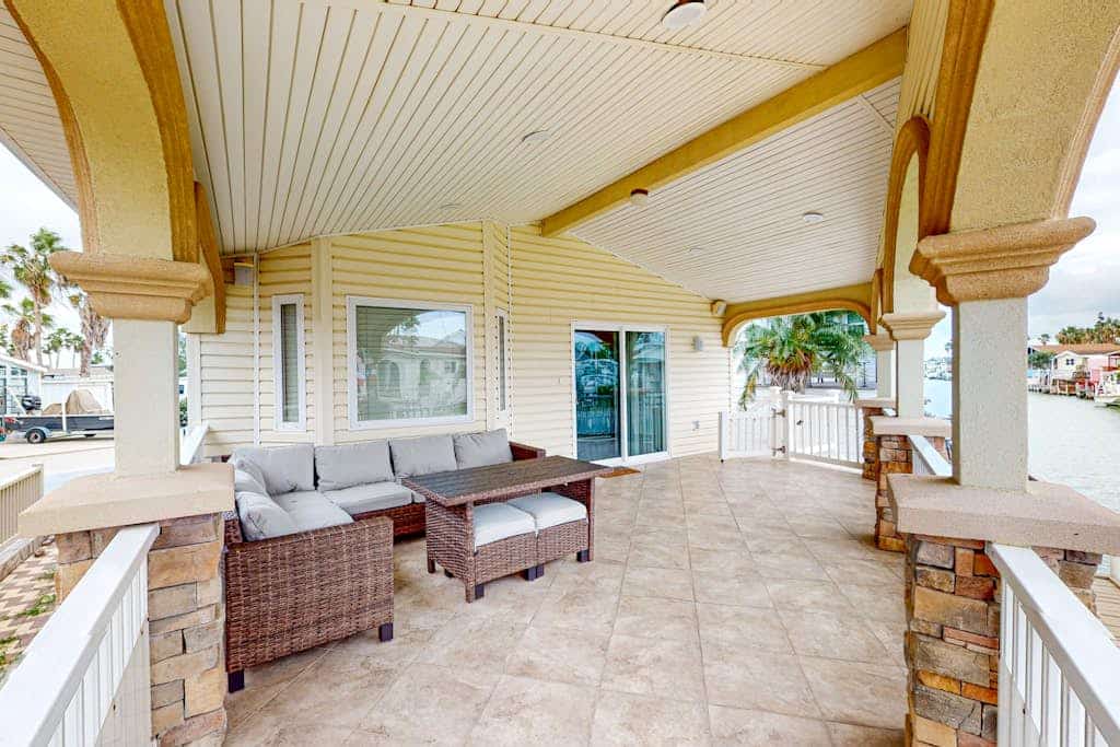 Single-level waterfront retreat with a furnished patio, AC, & washer/dryer